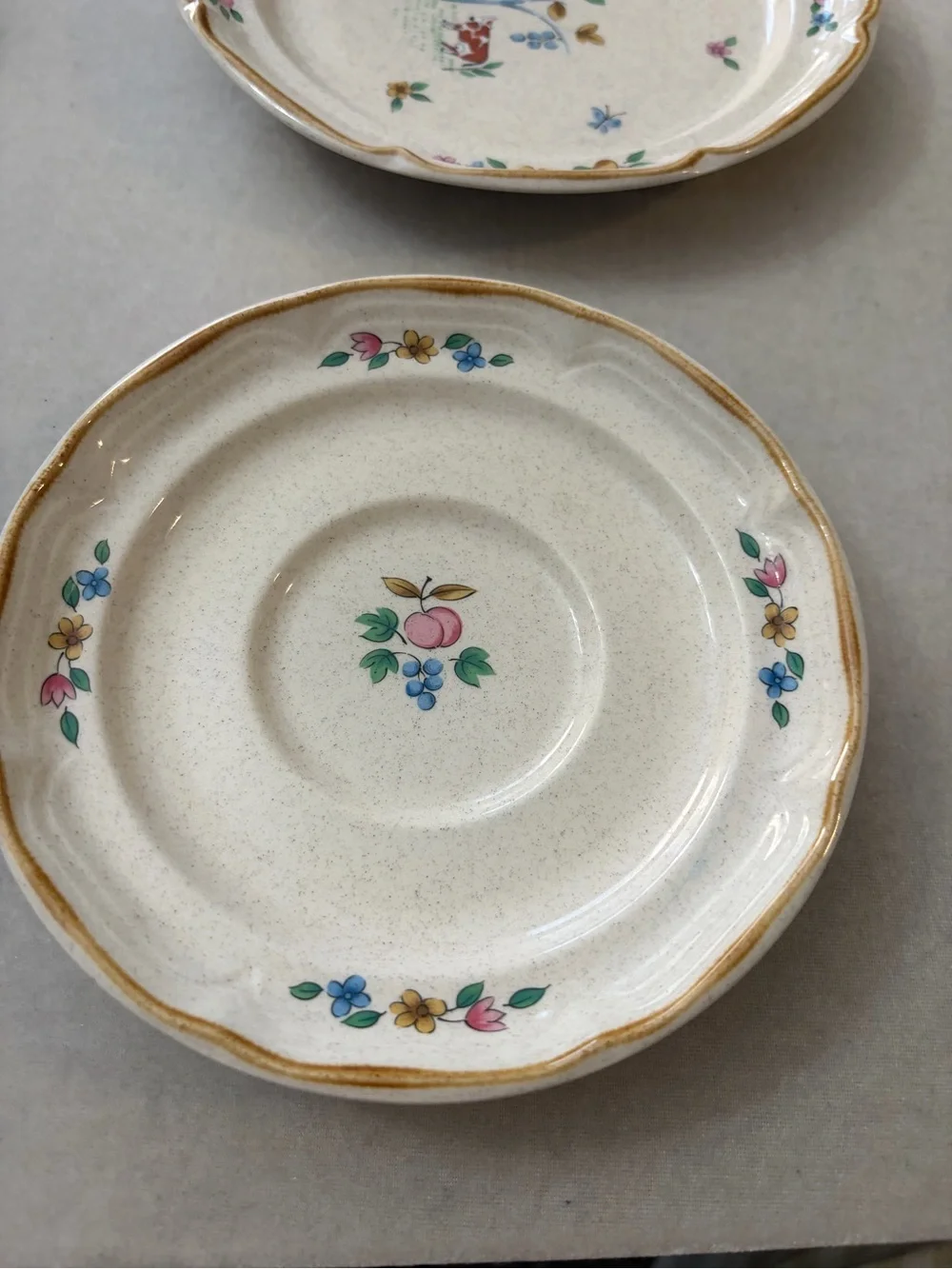 International Cream Ceramic Cup and Saucer Set with Hand-Painted Village Design